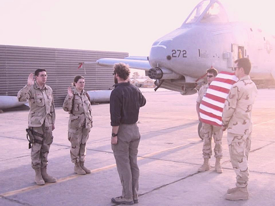 Jenny saluting the flag in uniform