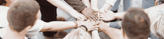Goup of business people putting their hands together for a hand stack