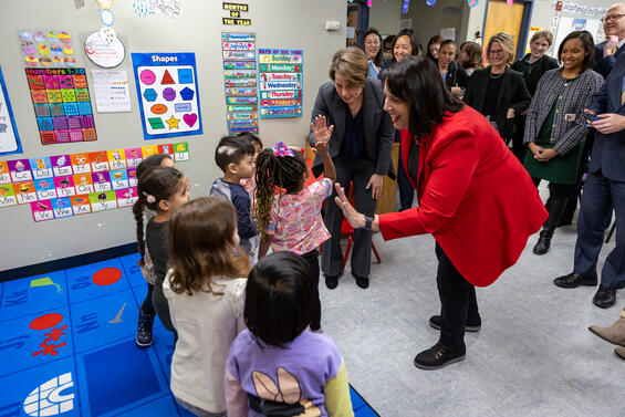 Governor and Lt. Governor high-fiving preschoolers
