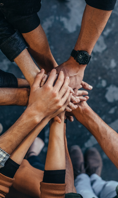 Hands together in a symbol of teamwork