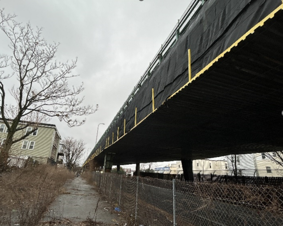 A view of the Tobin Bridge in Chelsea encased in a netting system to catch paint chips.