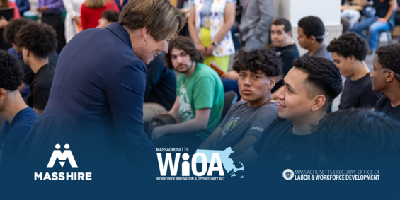 Governor Healey shakes hands with high school student.