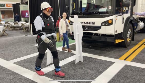 Person in AGNES suit in crosswalk