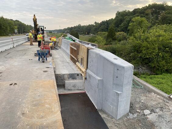 A view of the installation with crew in the background.