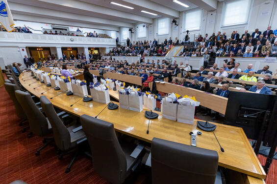 A wide-angle photo of the Gardner Auditorium filled with nearly 400 guests.