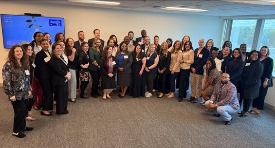 Thirty-eight aspiring school leaders from across Massachusetts stand together for a group photo.