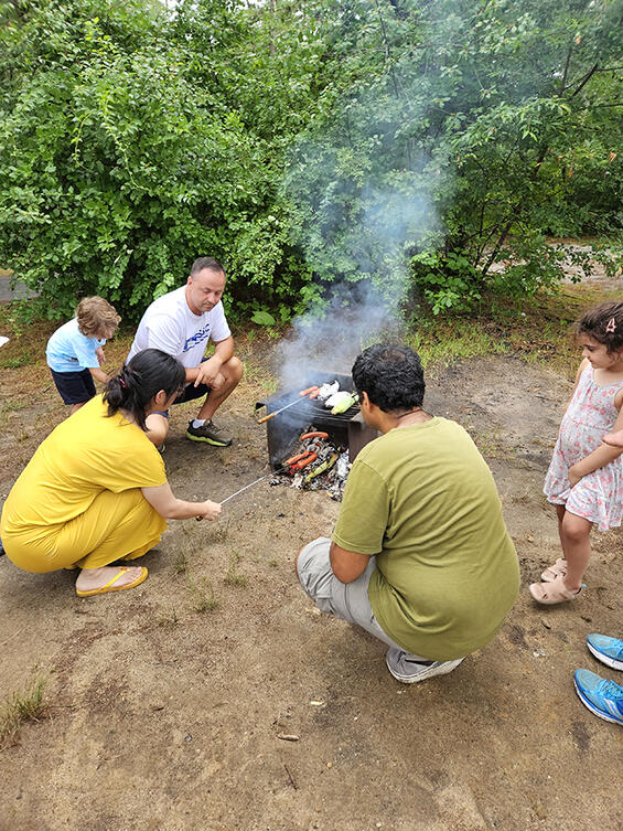 families cooking over an open fire