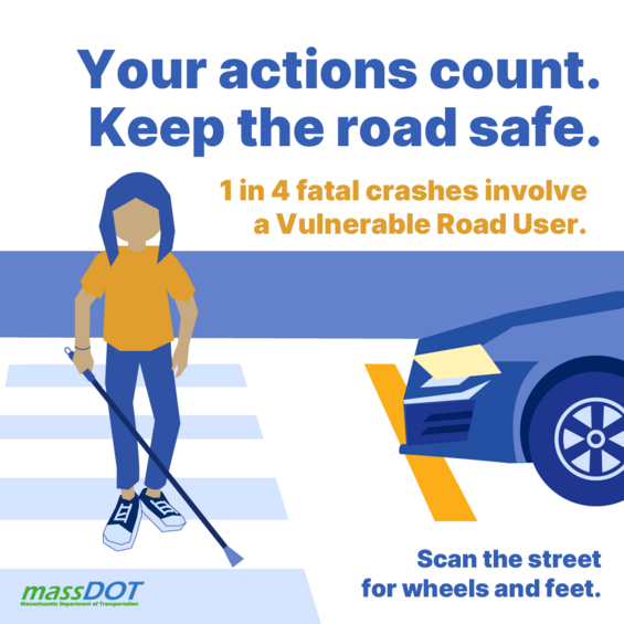 A car stops for a blind pedestrian crossing the street