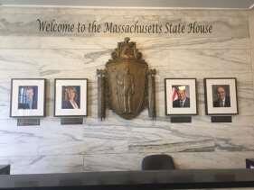Hooker Entrance display with state seal and portraits of leadership