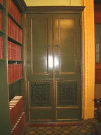 Green and bronze metal bookcases