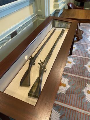Two muskets in a display case