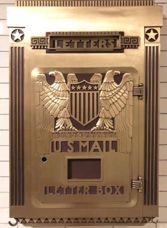 Shiny brass Post Office letter box