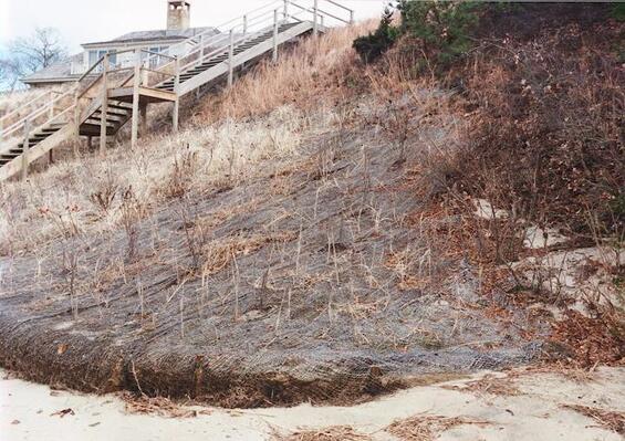 Winter scene showing a coastal bank with fiber blankets and coir rolls tapering into edge of property