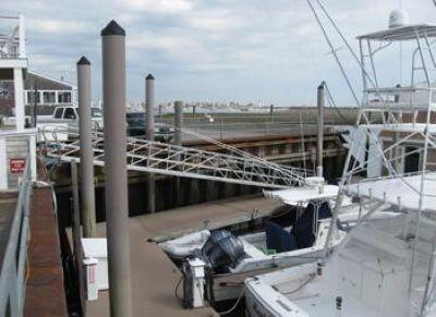 A marina with a steel bulkhead, docks, and boats.