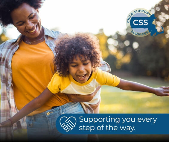 Mother holding young child. 