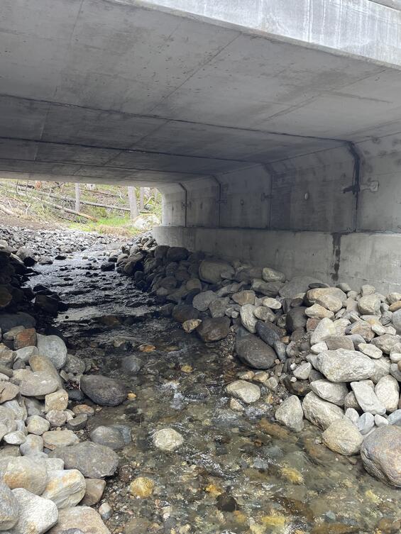 inside of upgraded culvert with natural rock bottom and flowing stream