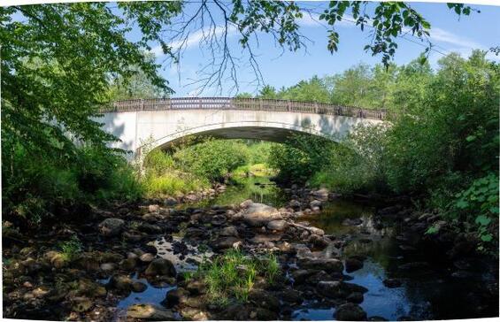 Bridge over a stream. View from water.