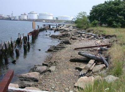 A severely deteriorated bulkhead with significant erosion of sediments