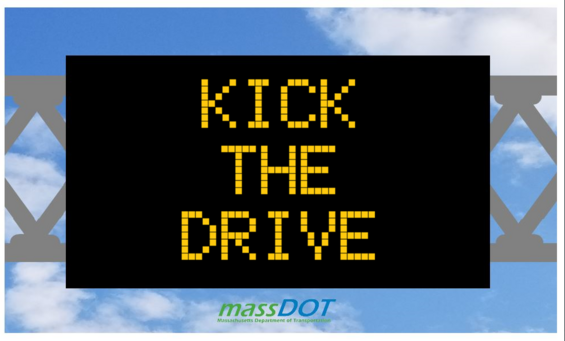 Kick the drive road sign