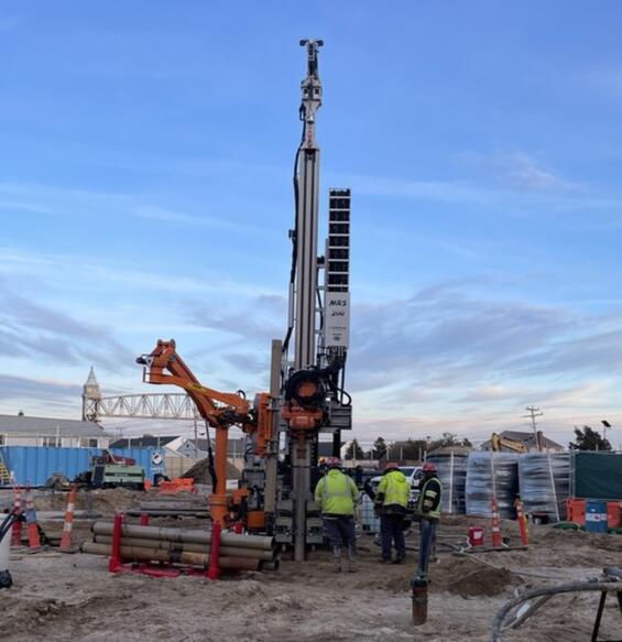 workers at ground source heat pump, MMA