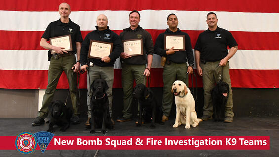 Five fire investigators and Bomb Squad members with their dogs