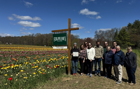 MDAR Commissioner Randle poses with staff next Ferjulian's Pick-Your-Own tulip field