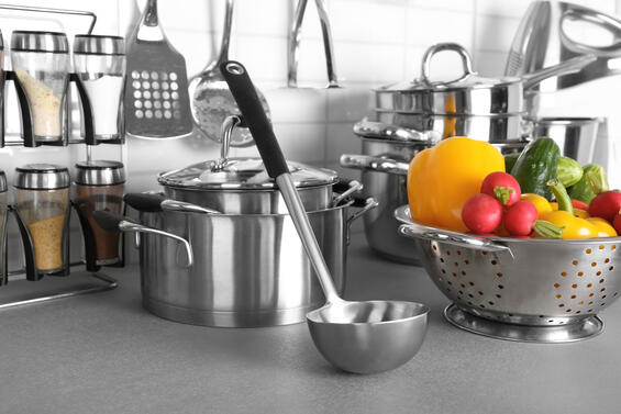 Spices, pans, and produce in a kitchen