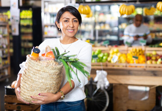 Woman with basket of fresh produce