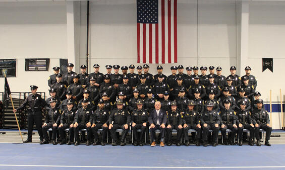Police Officers pose for a graduation photo
