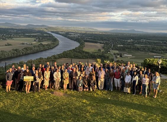 MDAR Commissioner Ashley Randle along with NEASDA Attendees Pose for a Photo during Sunset on Top of Mt. Sugarloaf in South Deerfield