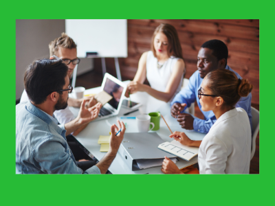a group of diverse people meeting around a table to discuss projects.