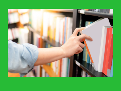 A person taking a book off a shelf