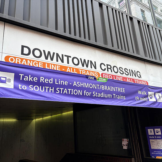 Purple special event signage at Downtown Crossing station.