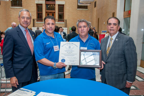 Mike’s Auto Body representatives at a State House awards ceremony. The company was recognized as a Champion of Toxics Use Reduction in 2016.