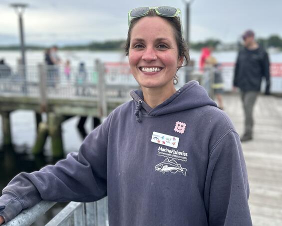 A fishing instructor on a pier.