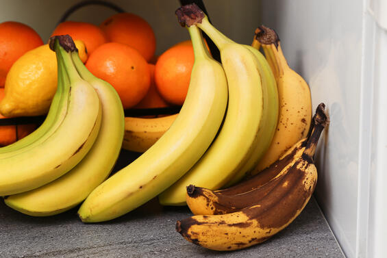 Oranges and Bananas stored on a countertop