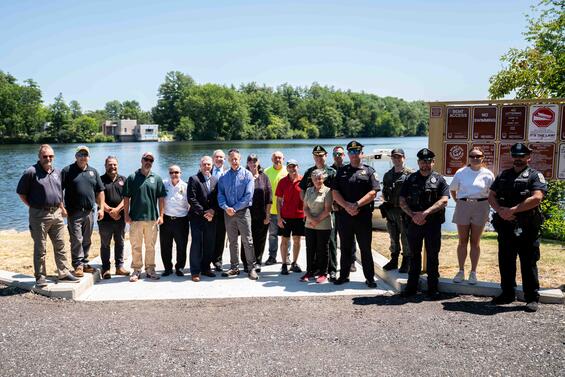 A group of people gather to celebrate the new boat ramp in Chelmsford. 