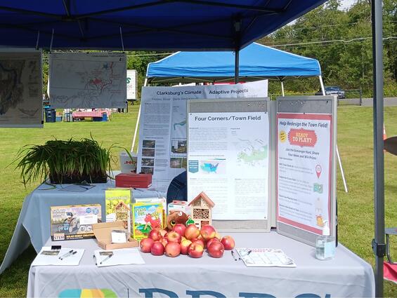 Table set up at a community event to engage the public about this project