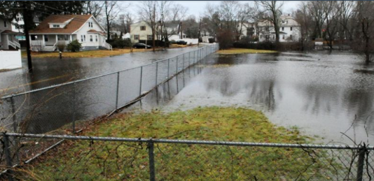 Widespread flooding in a road and adjacent field