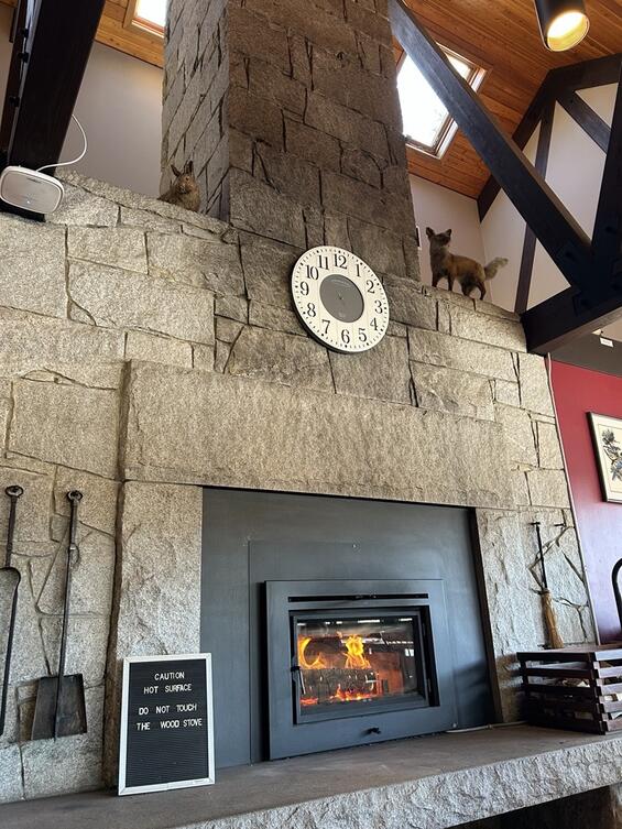 A wood stove burns in a DCR visitor center
