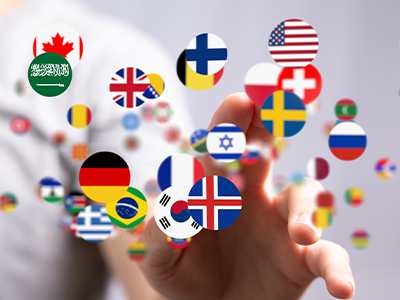 An image of several countries flags in circles floating in front of a hand
