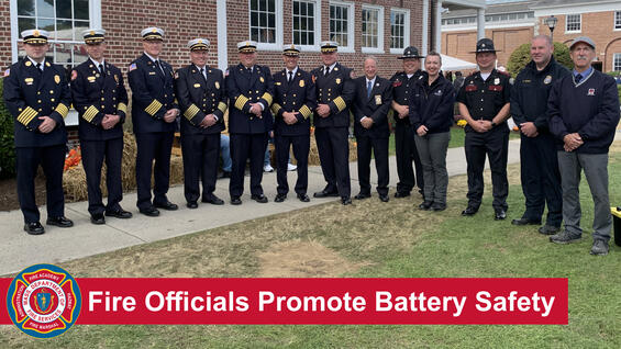 Fire chiefs and state fire marshals with the text "Fire Officials Promote Battery Safety"