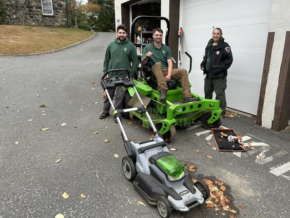 DCR staff with electric landscaping equipment