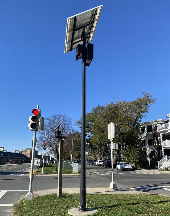A solar panel affixed to a streetlight
