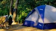 A campsite along the outskirts of the woods.