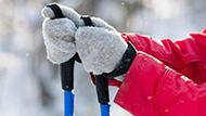 Person holding ski poles in winter.