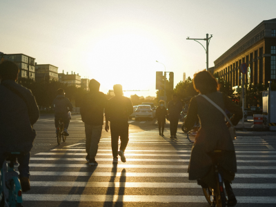 Bicyclists and pedestrians use a cross walk