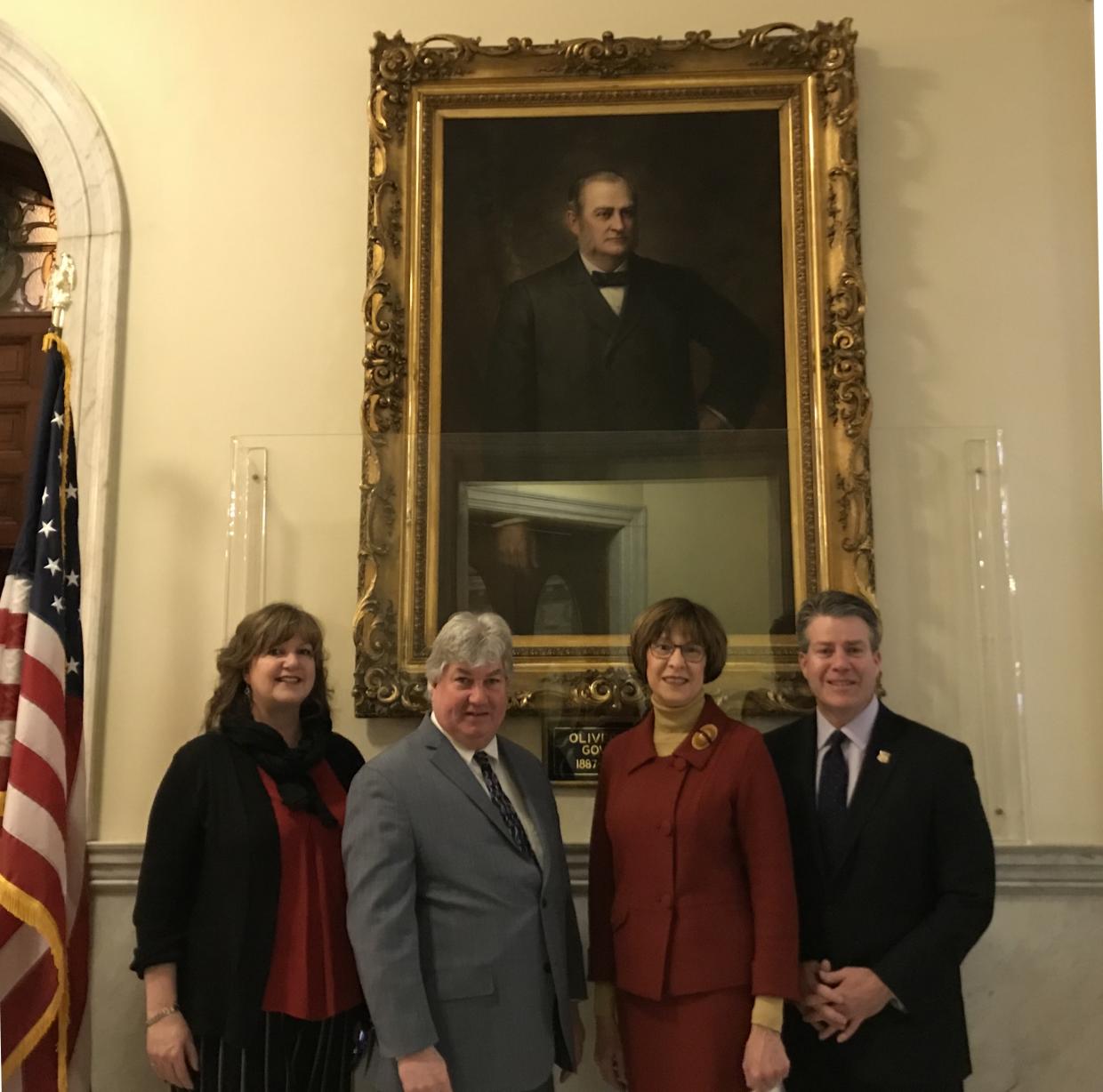 State Auditor Suzanne M. Bump unveiled a portrait of former Massachusetts Governor and former Easton resident, Oliver Ames. From left: Dottie Fulginiti of the Easton Select Board; Sen. Michael D. Brady; Auditor Bump; and Sen. Walter F. Timilty.