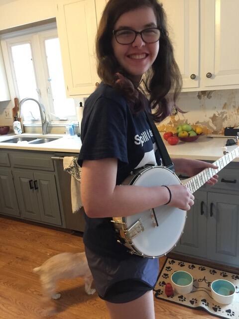 Elana playing the banjo. Photo courtesy of Elana Regan