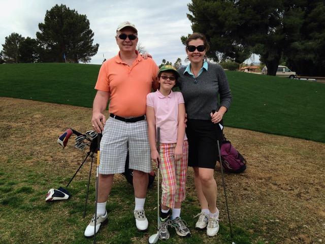 Elana with her parents Sara and Francis Regan on the golf course. Photo courtesy of Elana Regan.